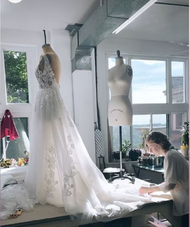 Anna working on a wedding dress in her studio